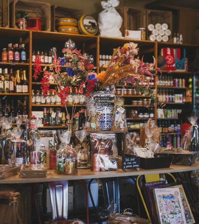 A vibrant display of flowers and gifts in a charming local shop, perfect for gift-giving inspiration.